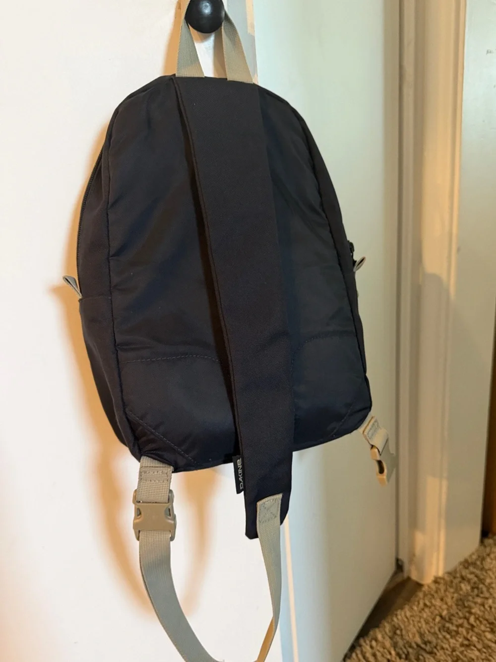 Dakine Black Sling Backpack with Contrasting Tan Accents